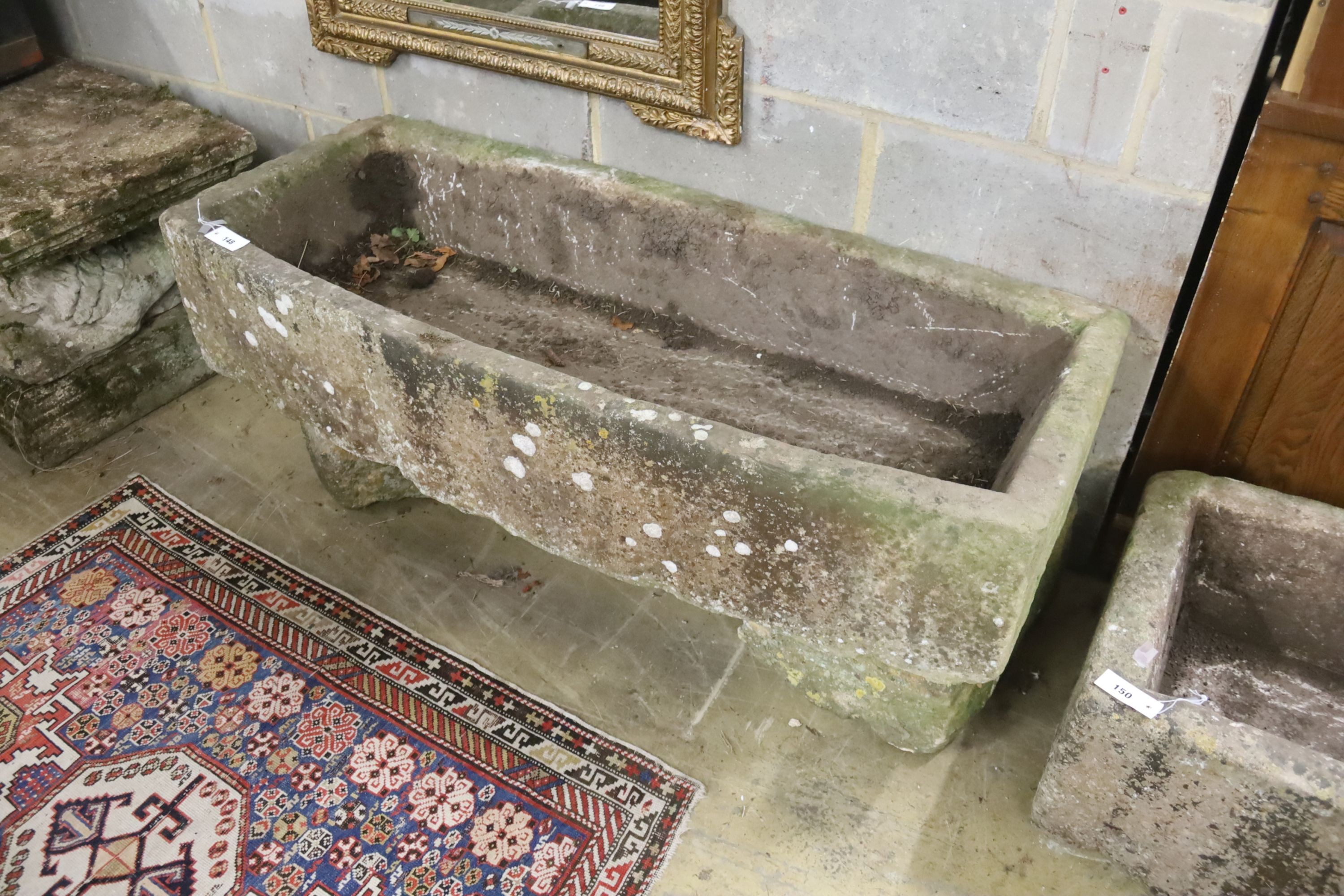 A 19th century carved stone bow fronted trough, length 133cm, depth 57cm, height 54cm